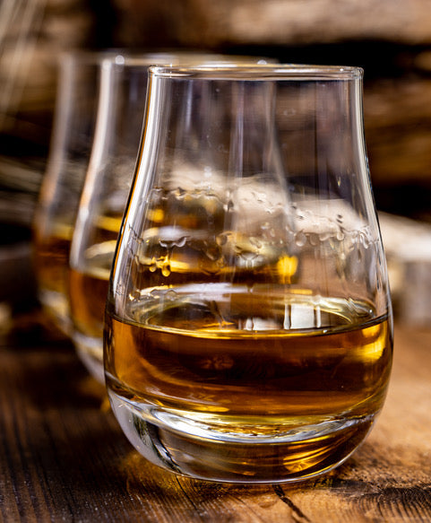 Photographs of a flight of whiskies for tasting