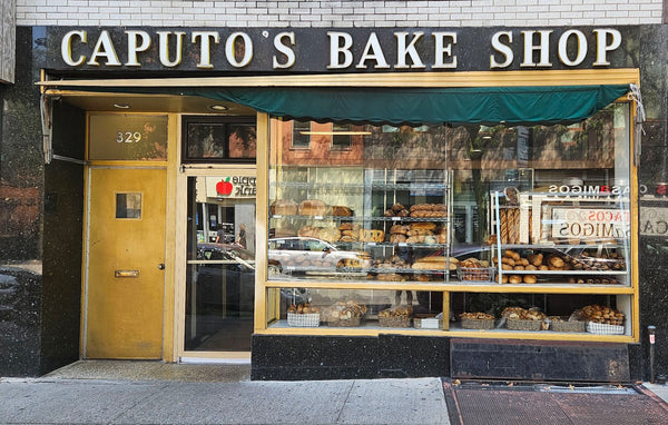 Caputo's Bake Shop storefront with display of baked goods