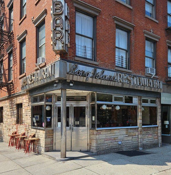 Long Island Restaurant with a bar sign on a brick building