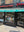  storefront of Damascus Pita & Pastry Shop with green and black facade