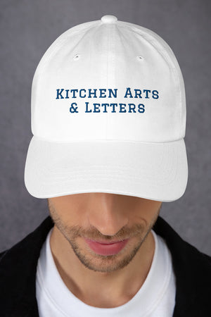 Book Cover: KAL Hat in White with Navy Embroidery