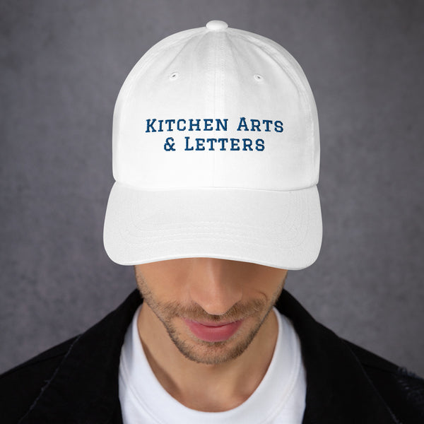 Book Cover: KAL Hat in White with Navy Embroidery